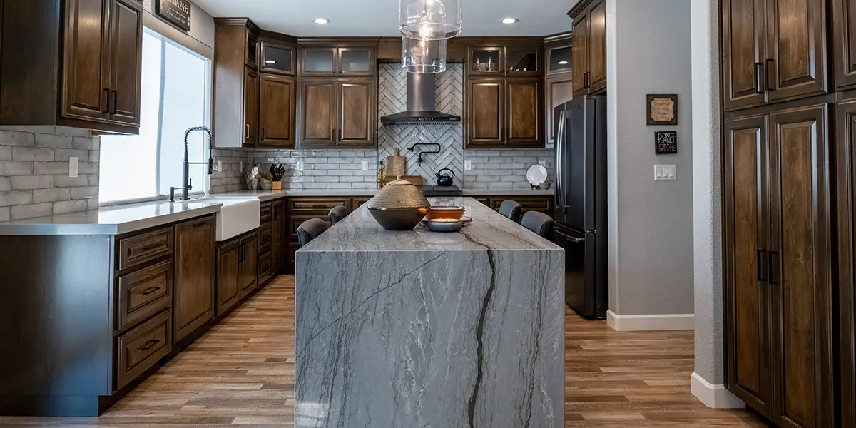 Kitchen renovation with wooden cabinets and stone countertop by KHB Construction