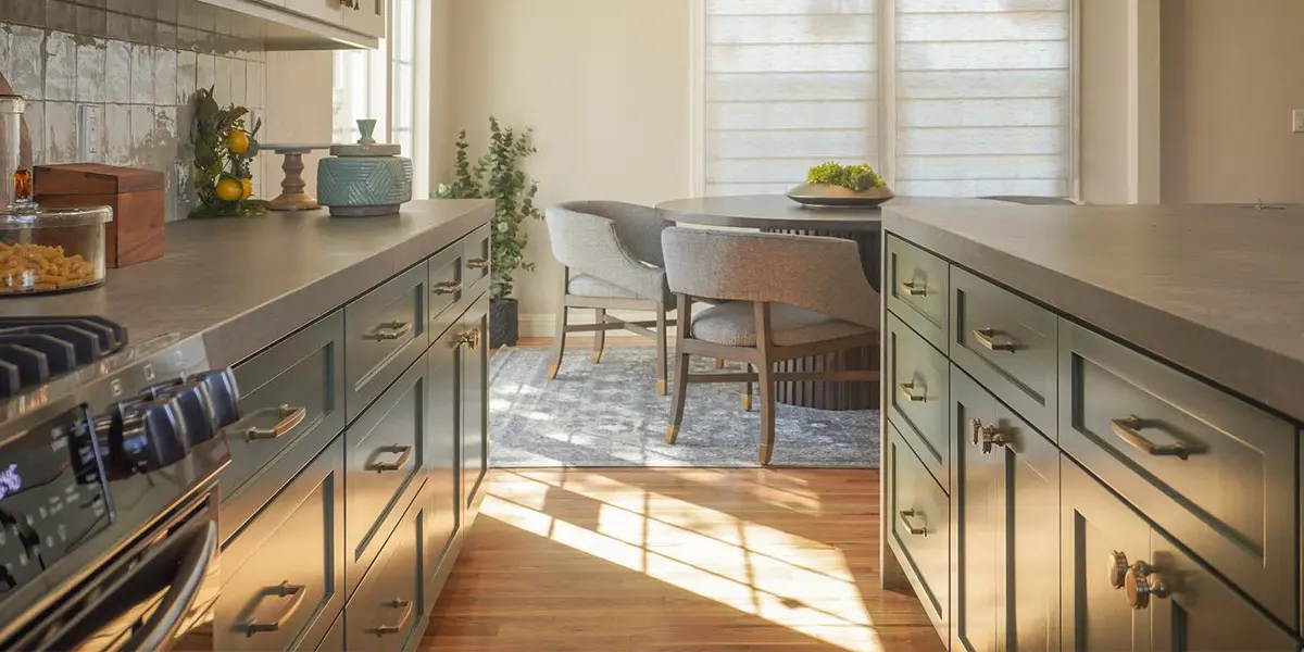 Kitchen remodel from KHB Construction - pastel green cabinets and kitchen island