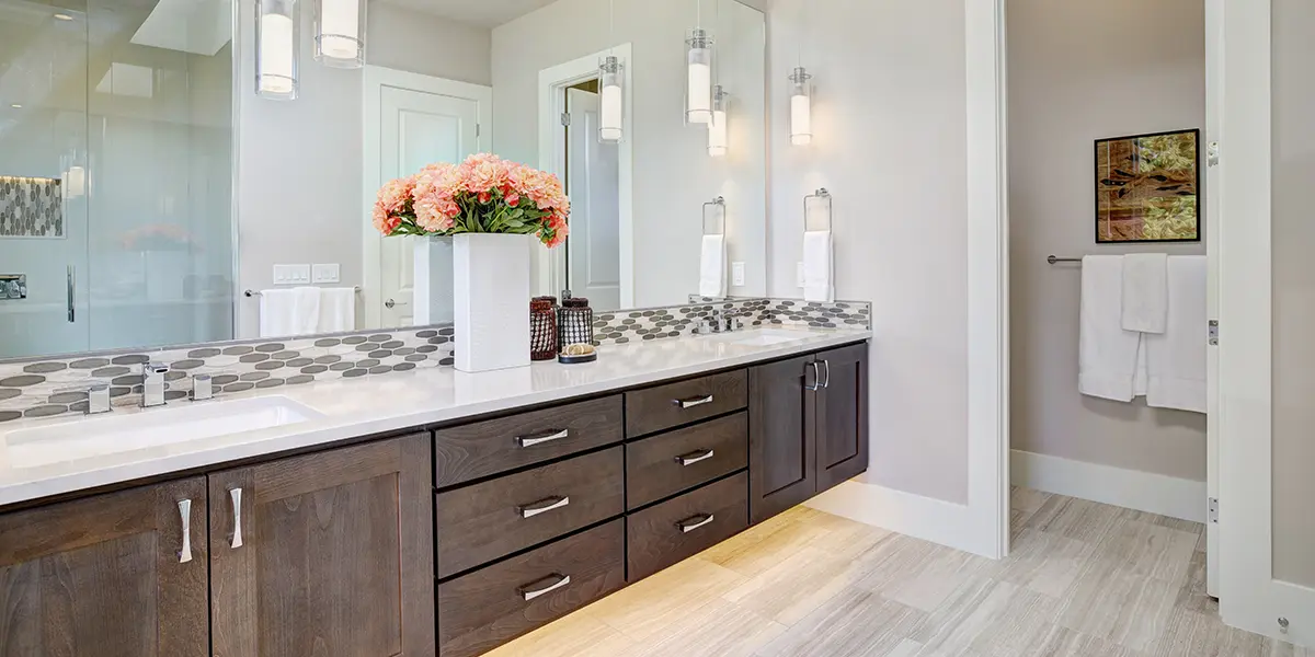 Bathroom with pendant lighting and under-vanity lighting