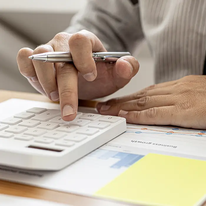 Person using calculator to find out home renovation budget