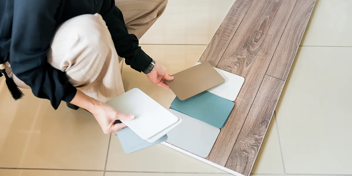 Person choosing colors that match their flooring