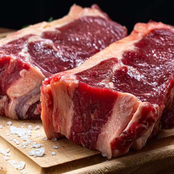 Steak piece uncooked, on cutting board