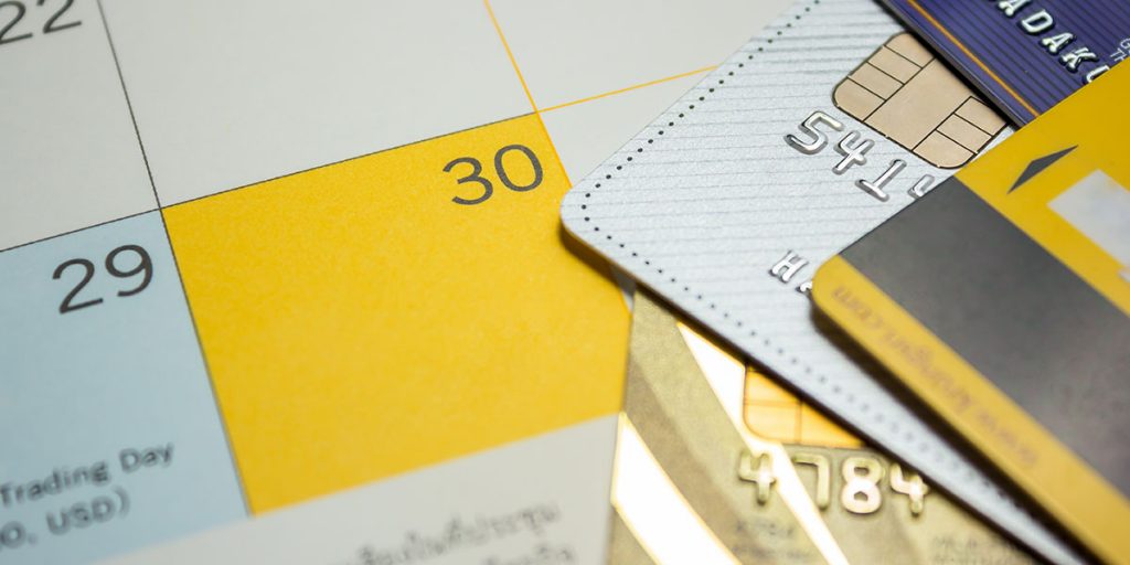 Credit cards and calendar for payment schedule during a renovation