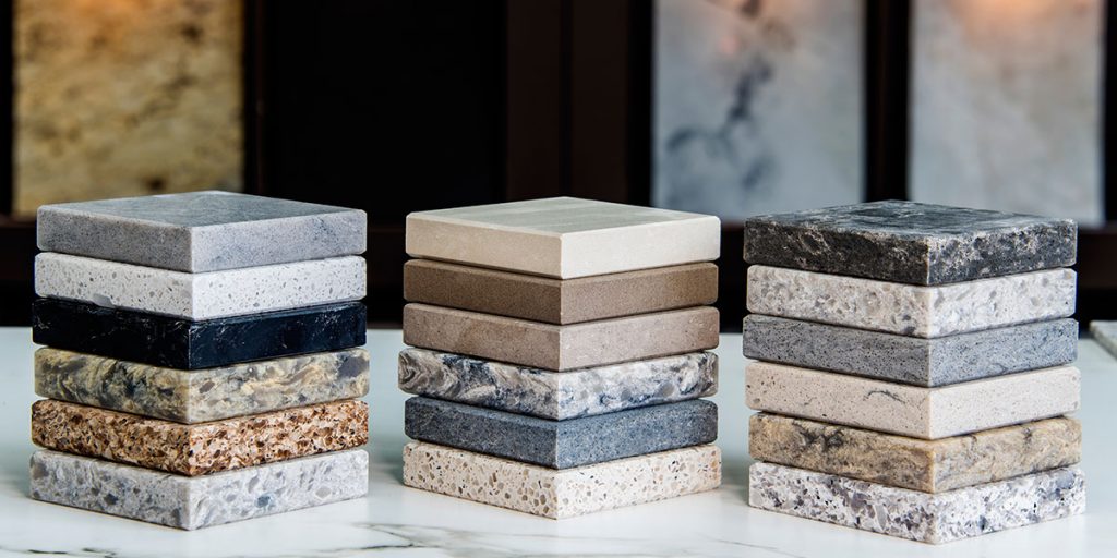 Stack of countertop material swatches for home renovation in Modesto