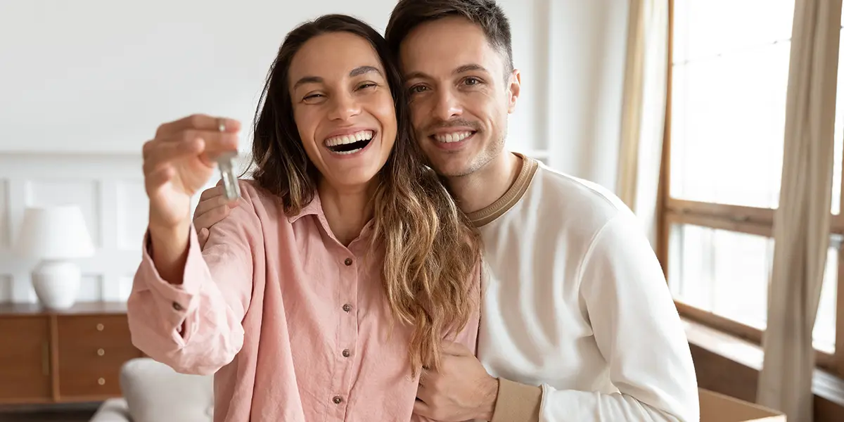 Couple welcoming their newly renovated home