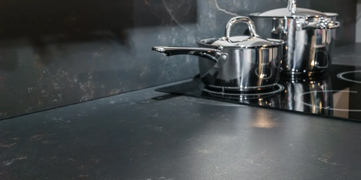 Black kitchen countertop and backsplash