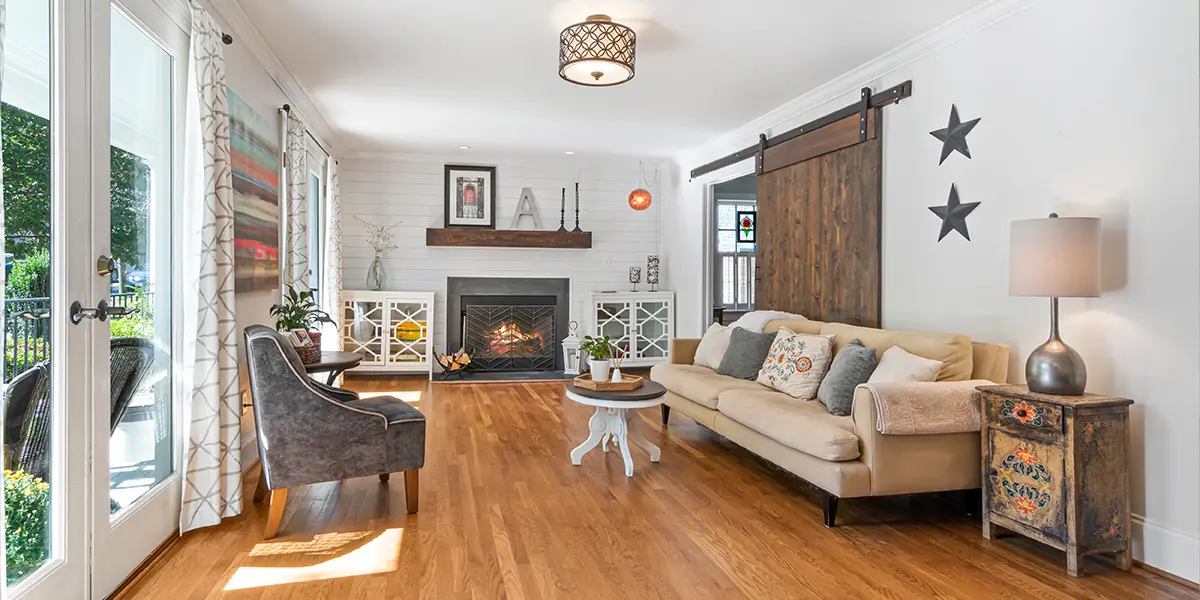 Home interior with farmstyle door and large doors pointing to the backyard