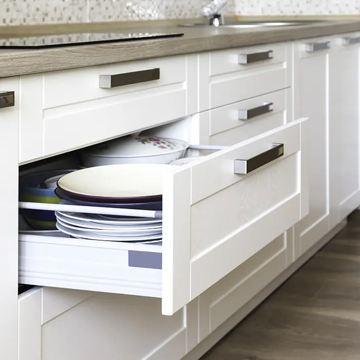 White inset cabinets with silver handles