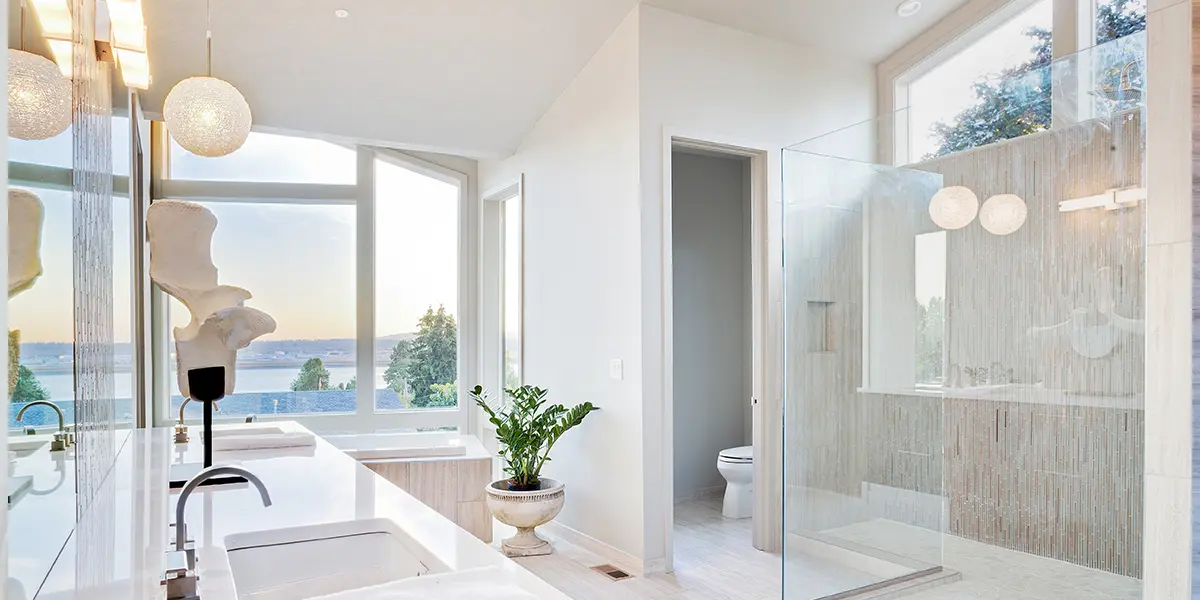 Large tall bathroom with large windows and natural light