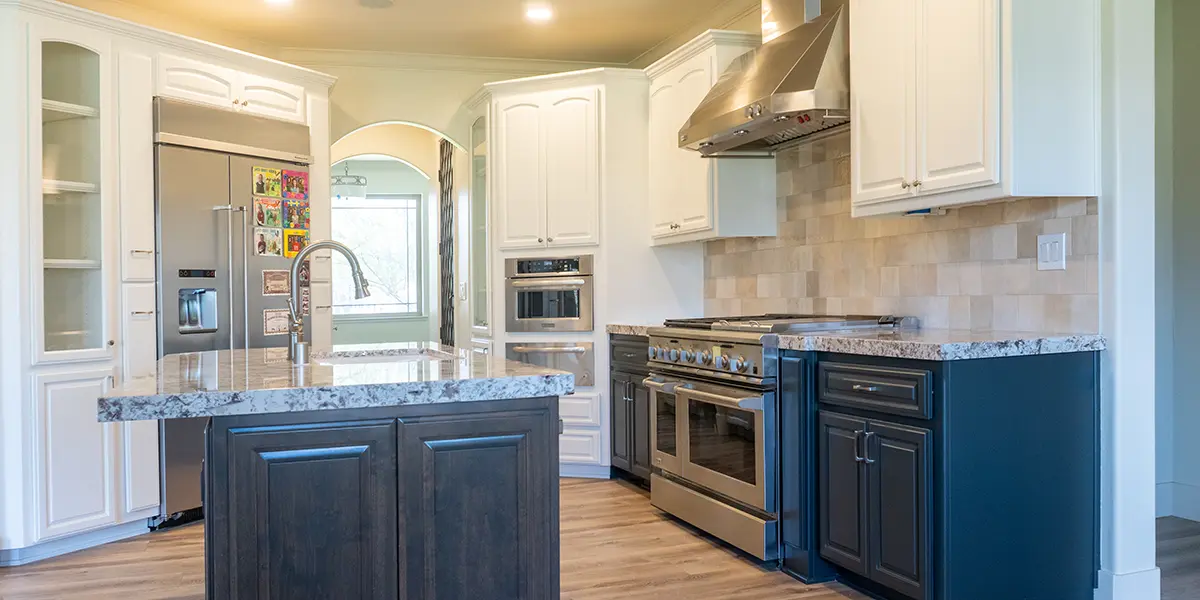 Dusty blue kitchen cabinets in a kitchen renovated by KHB Construction