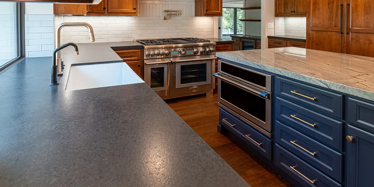 Granite kitchen countertop for sink area and marble countertop for island area