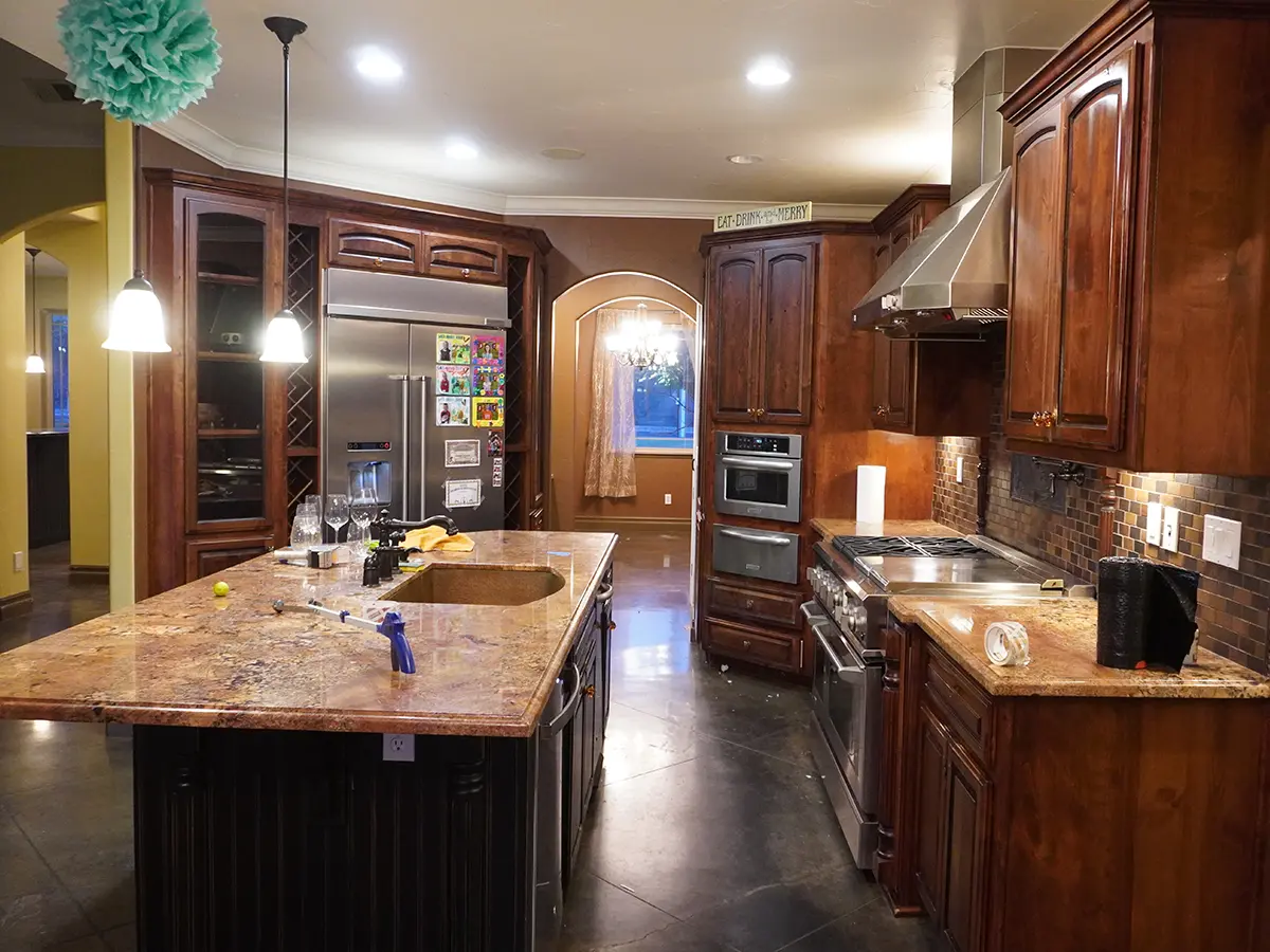 Wood cabinets and a granite countertop in an old kitchen