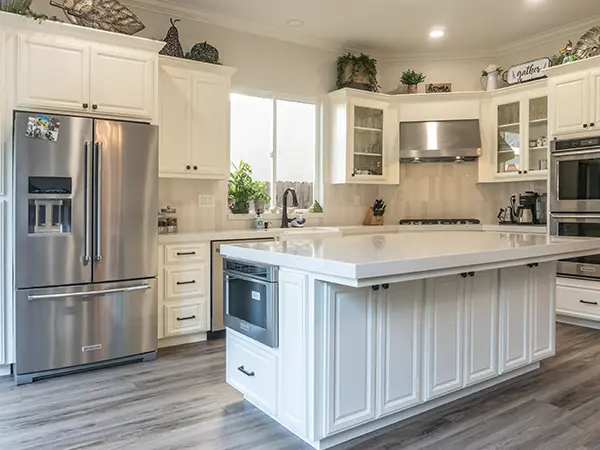 White cabinets on a kitchen island with marble countertop