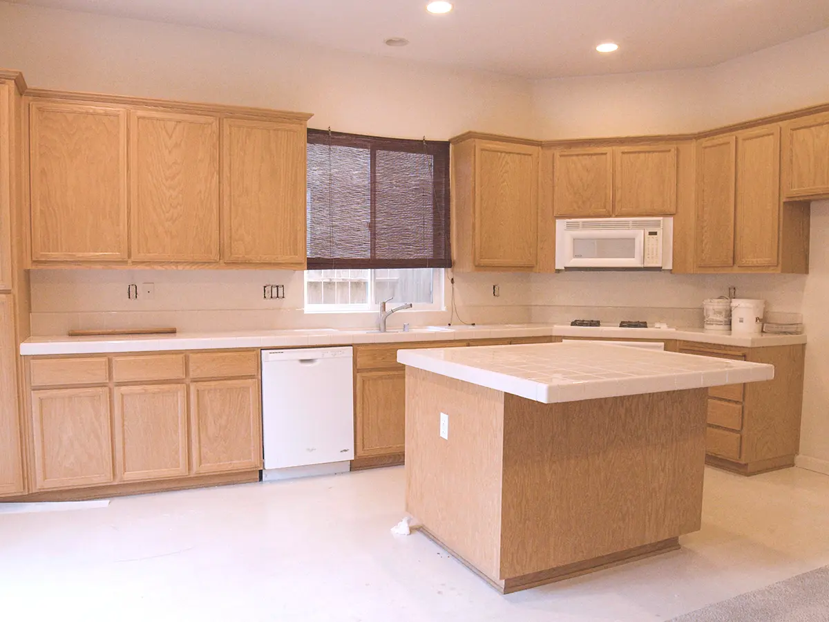 Unfinished wood cabinets in a new kitchen