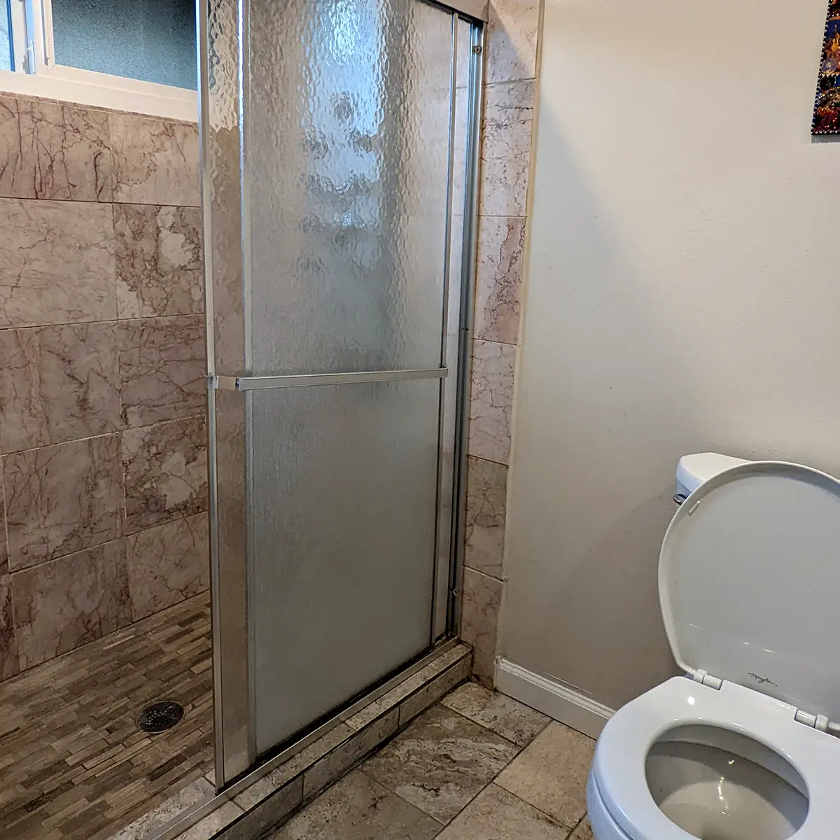 An older walk-in shower