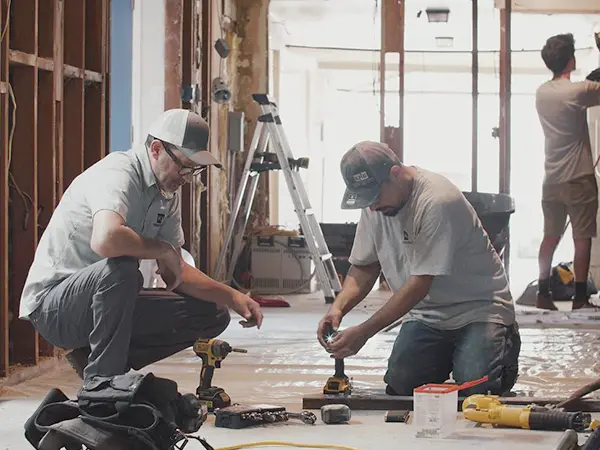 Two KHB employees working on a remodel