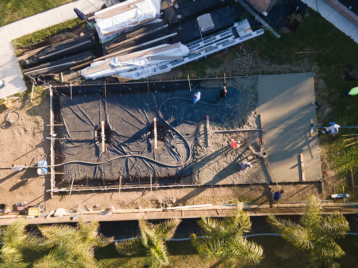 A drone shot of the foundation of a large home addition