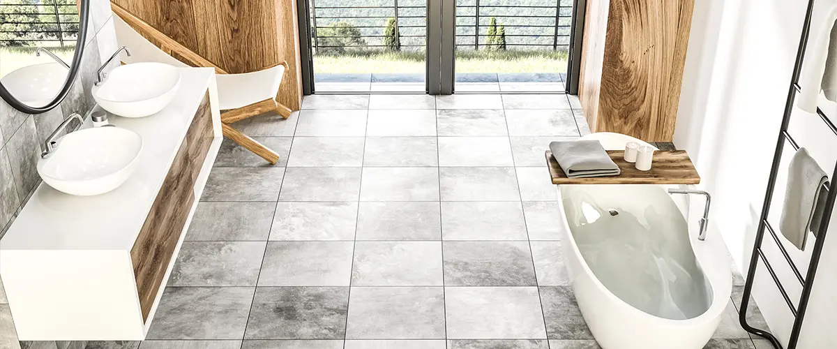 Bathroom flooring with large tile flooring and a double white vanity