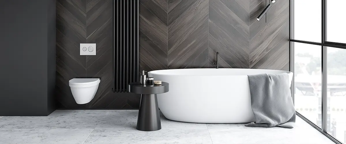 A beautiful black and white bathroom with dark walls