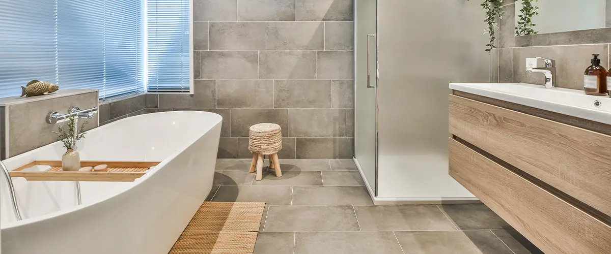 A bathroom remodeling in Tracy with large tile used on floors and walls