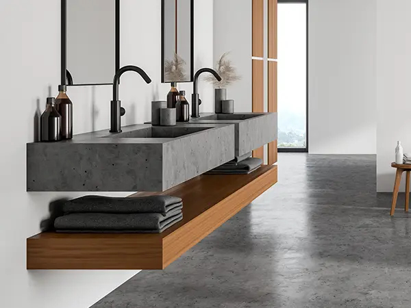 A modern vanity with concrete countertops