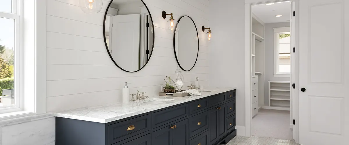 white bath with blue vanity