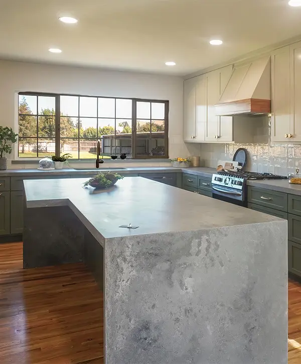 A concrete waterfall countertop in a kitchen remodeling in Modesto