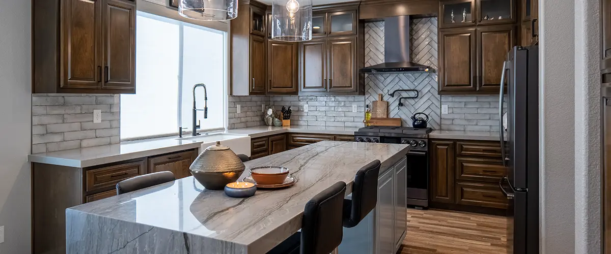 A kitchen remodeling in Modesto with concrete waterfall countertop on island