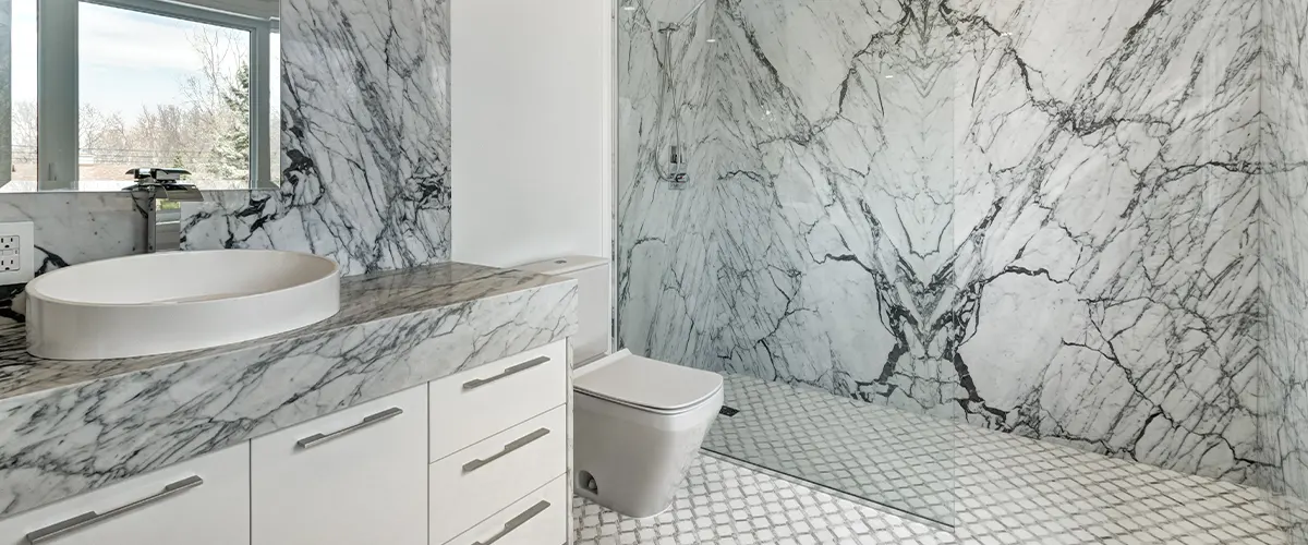 full marble bathroom with shower