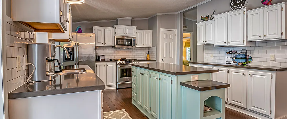 white kitchen with green island