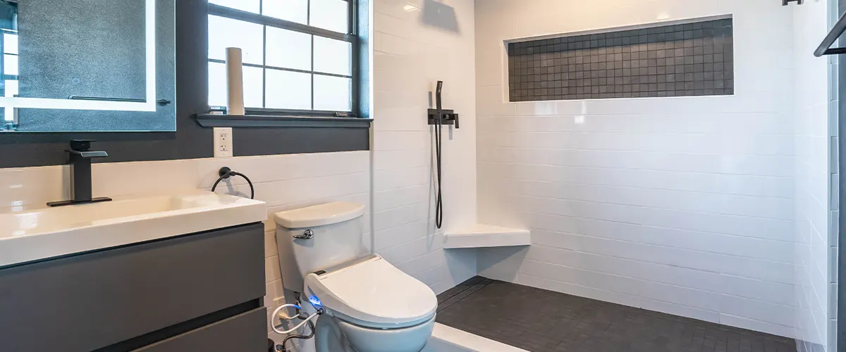 bathroom with toilet near shower area