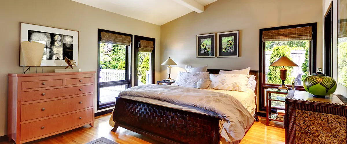 bedroom with wood flooring and large windows