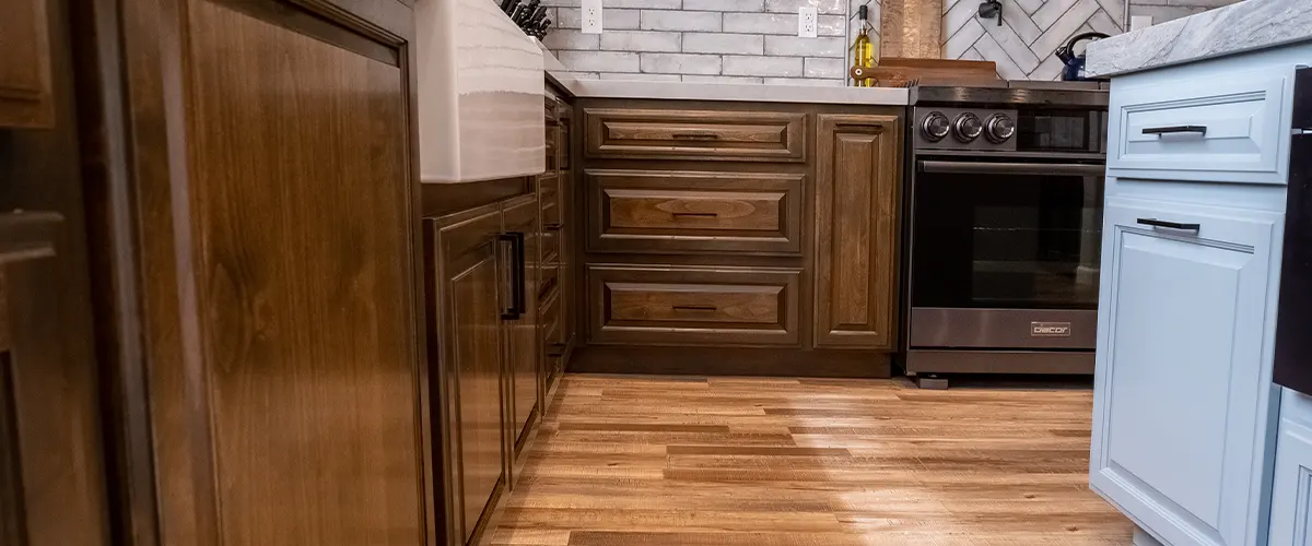 brown kitchen with hardwood floors