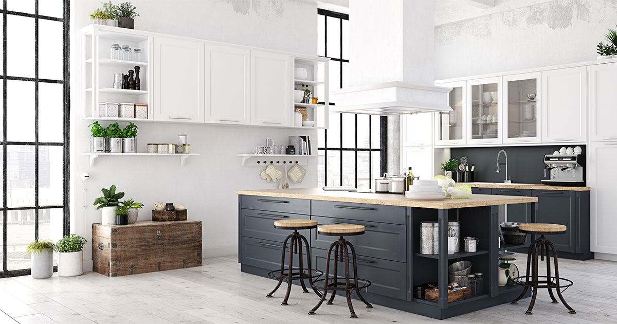 Large kitchen remodeling with white cabinets and a black island with stools