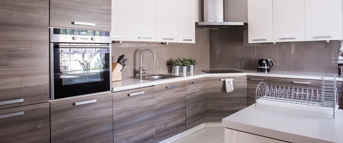 Wooden cupboards and integrated kitchen appliances in a modern room