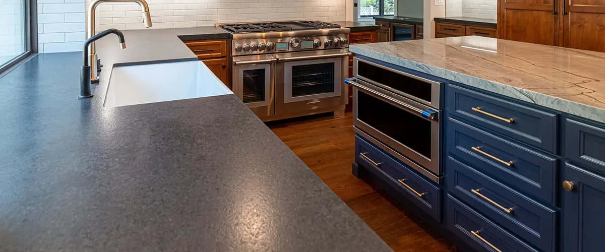 countertop installation and kitchen remodeling with navy cabinets