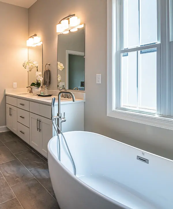 A freestanding tub with a vanity