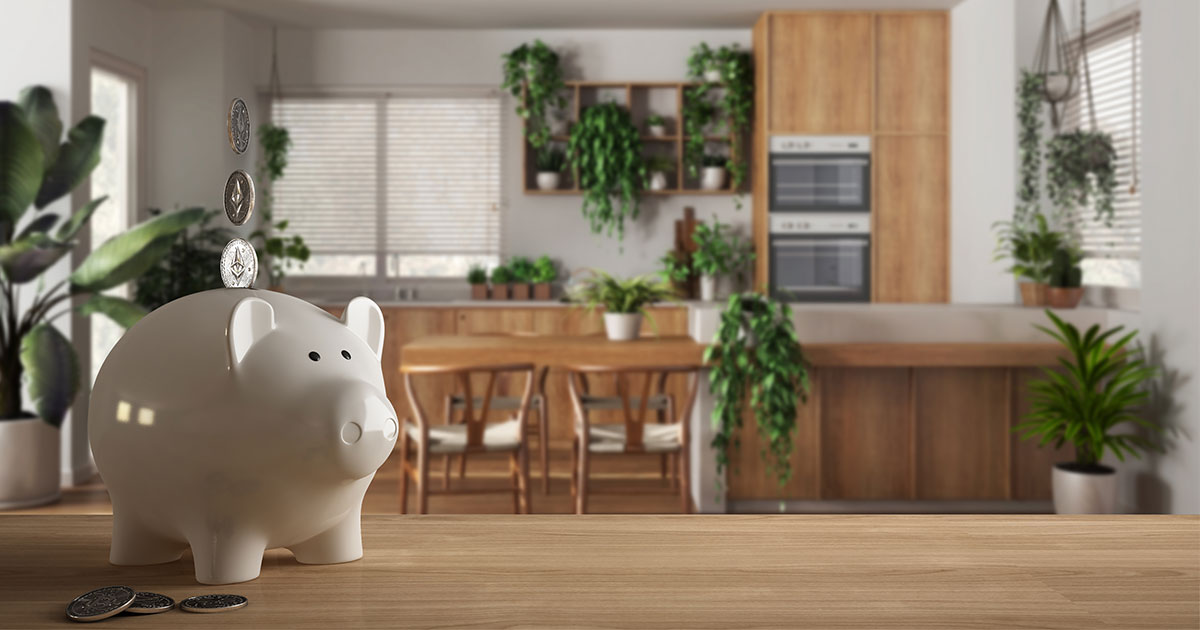 how to save money on a kitchen remodel with piggy bank in foreground