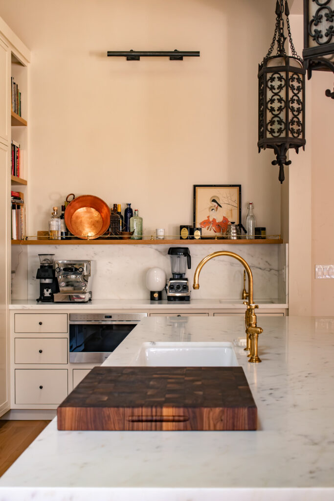 Butler pantry with a second sink and a working counter off the main kitchen