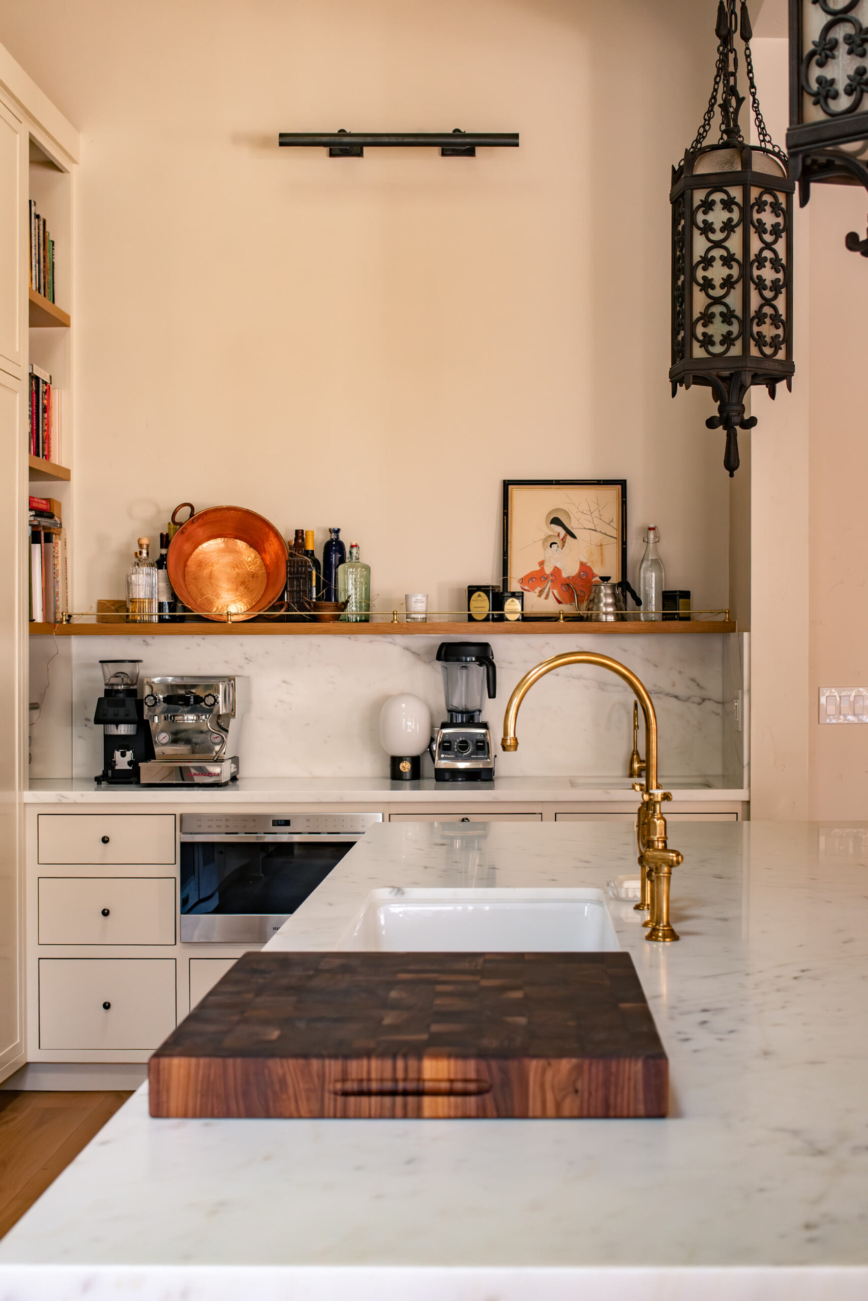 Butler pantry with a second sink and a working counter off the main kitchen