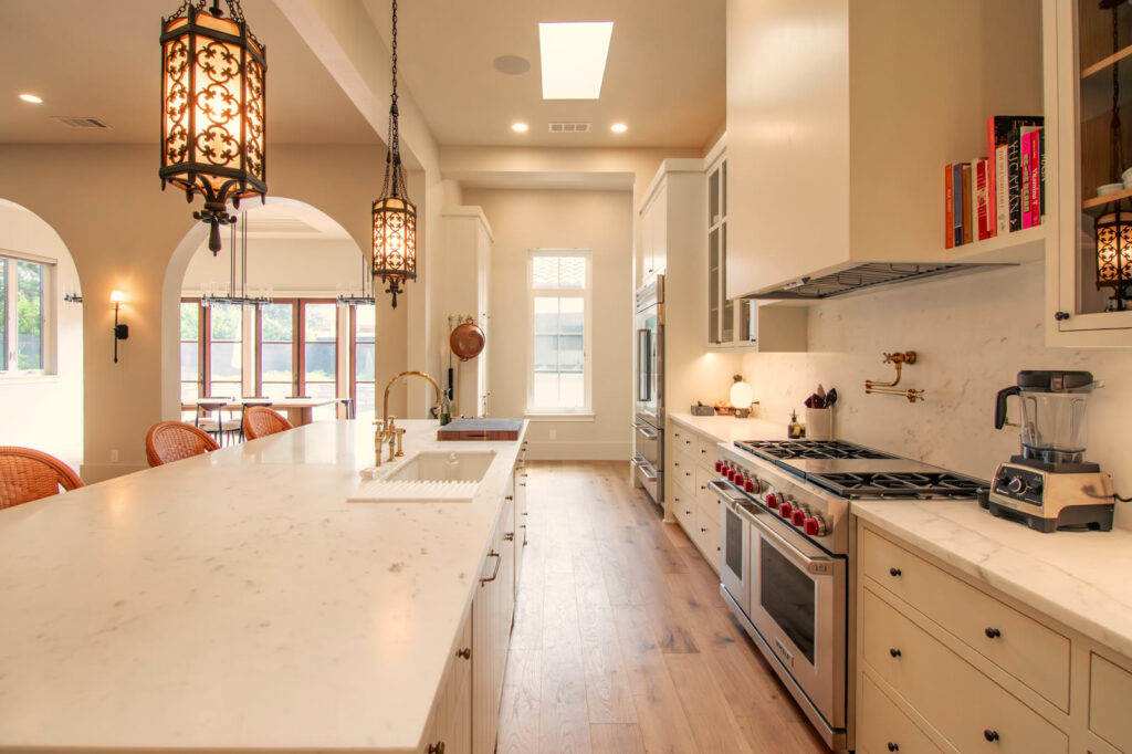 The main kitchen run under iron lantern pendants